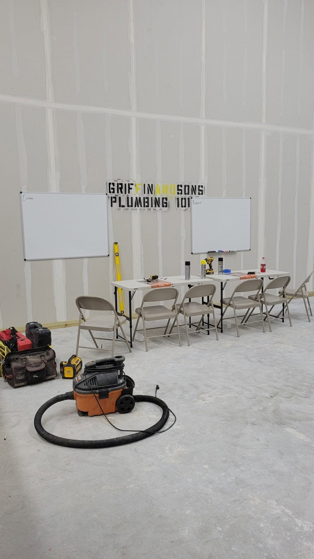 Griffin & Sons Plumbing 101 training room with whiteboards, worktables and tools